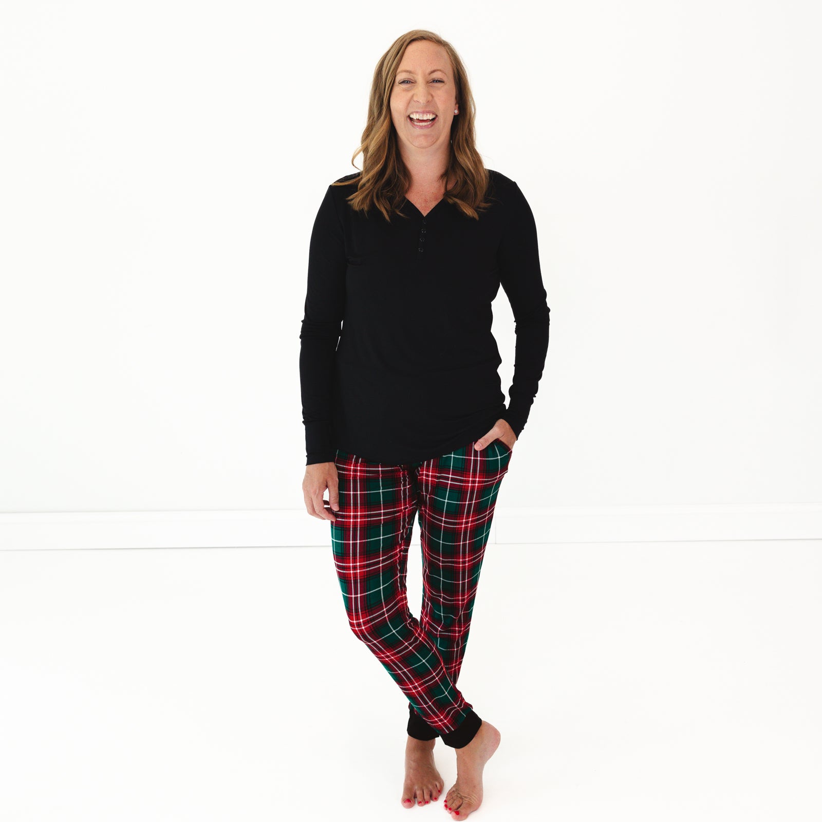 Woman wearing Fireside Plaid Women's Pajama Pants and Black Women's Pajama Top