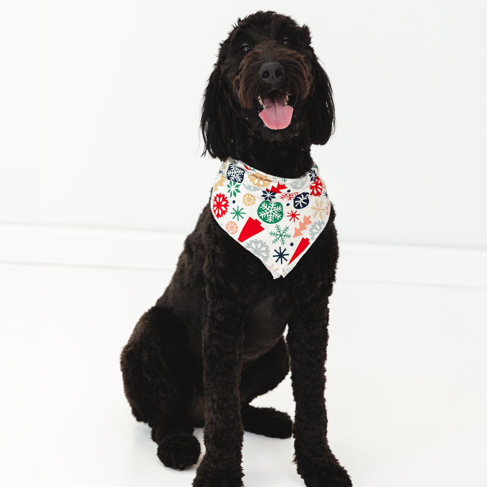 Image of a brown/black dog wearing the Modern & Merry Pet Bandana