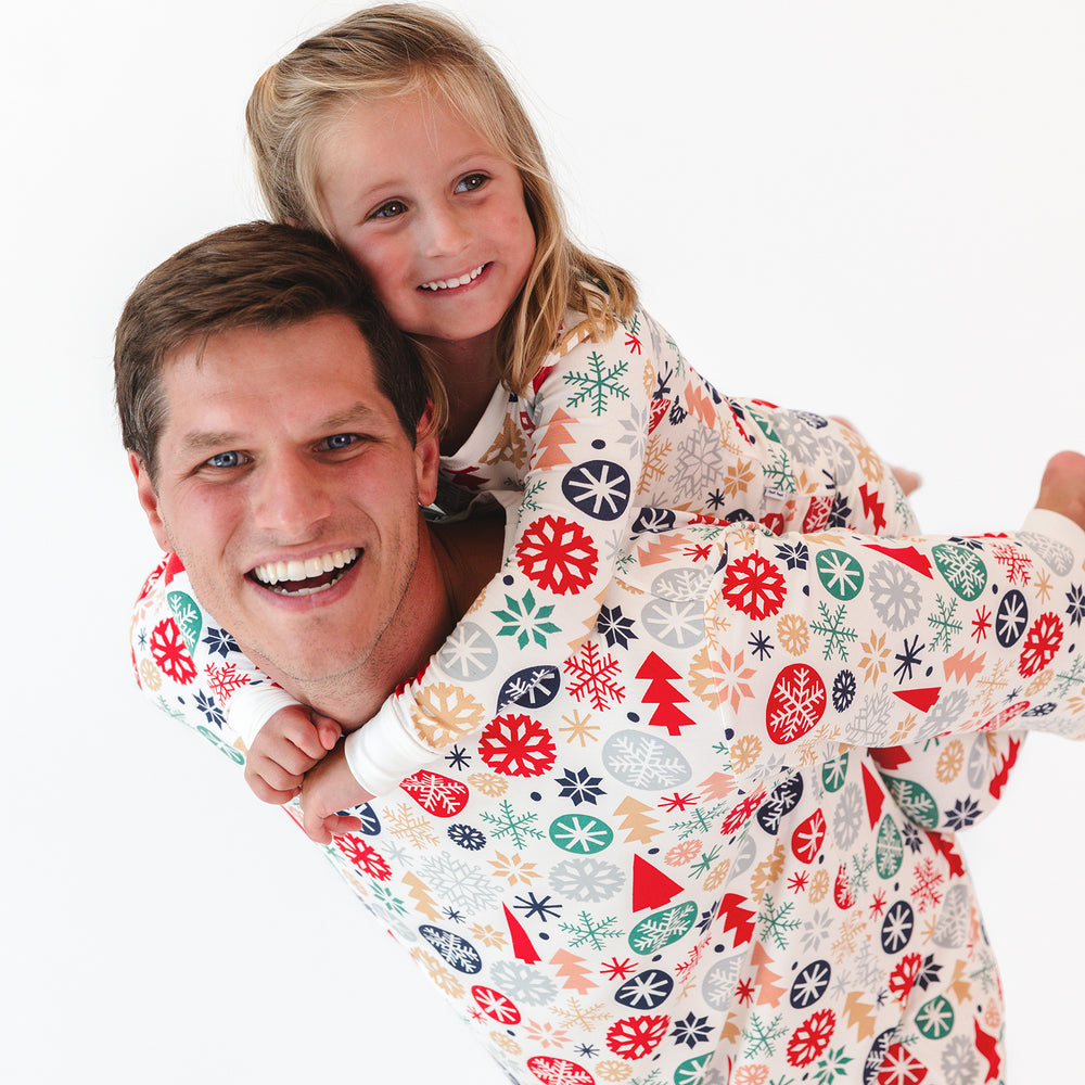 Male model posing with child while wearing the Modern & Merry Men's Pajama Top