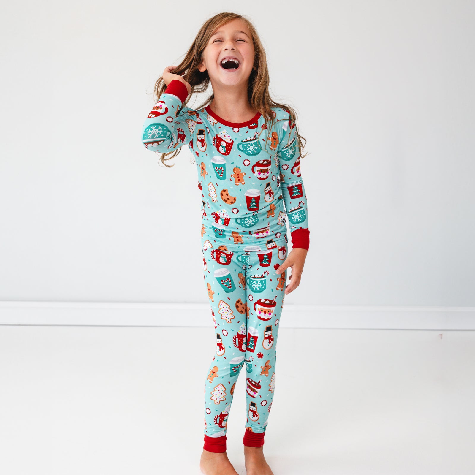 Image of a child wearing a Peppermint Mocha Two-Piece Pajama Set