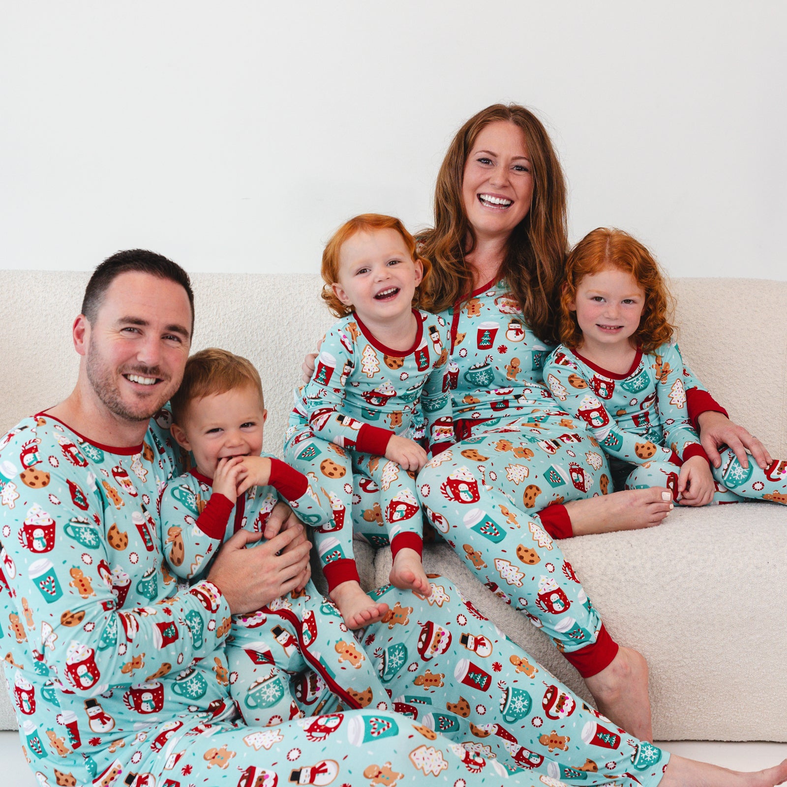 Family of five wearing matching Peppermint Mocha pajamas