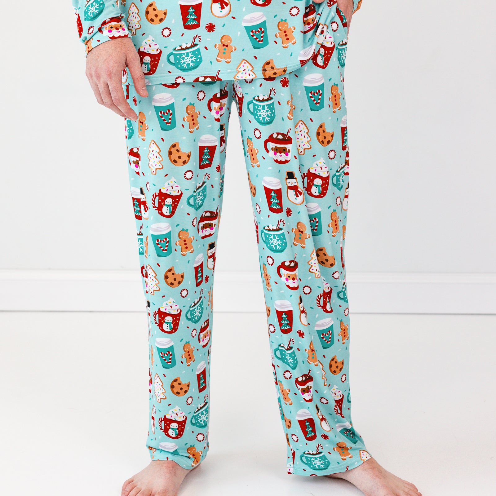 Close up image of a man wearing Peppermint Mocha Men's Pajama Pants and matching Pajama Top