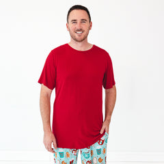 Smiling male model is wearing the Holiday Red Men's Short Sleeve Pajama Top