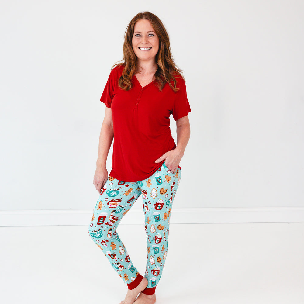 Woman wearing Peppermint Mocha Pajama Pants and a Holiday Red Short Sleeve Pajama Top