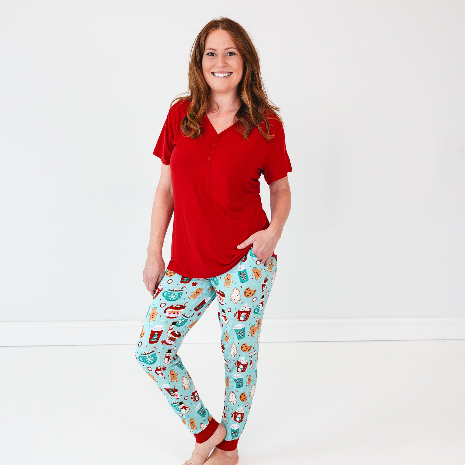 Woman wearing Peppermint Mocha Pajama Pants and a Holiday Red Short Sleeve Pajama Top