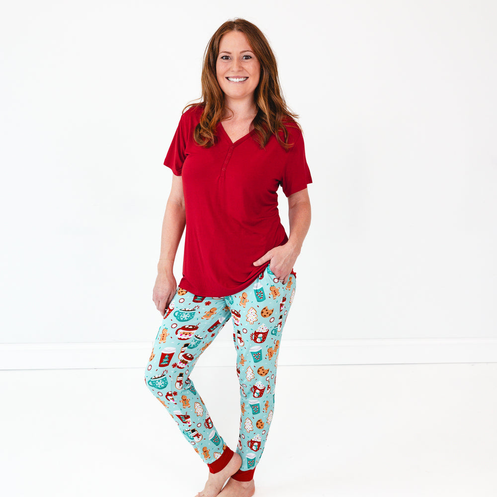 Female model is wearing the Holiday Red Women's Short Sleeve Pajama Top and Peppermint Mocha Women's Pajama Pants