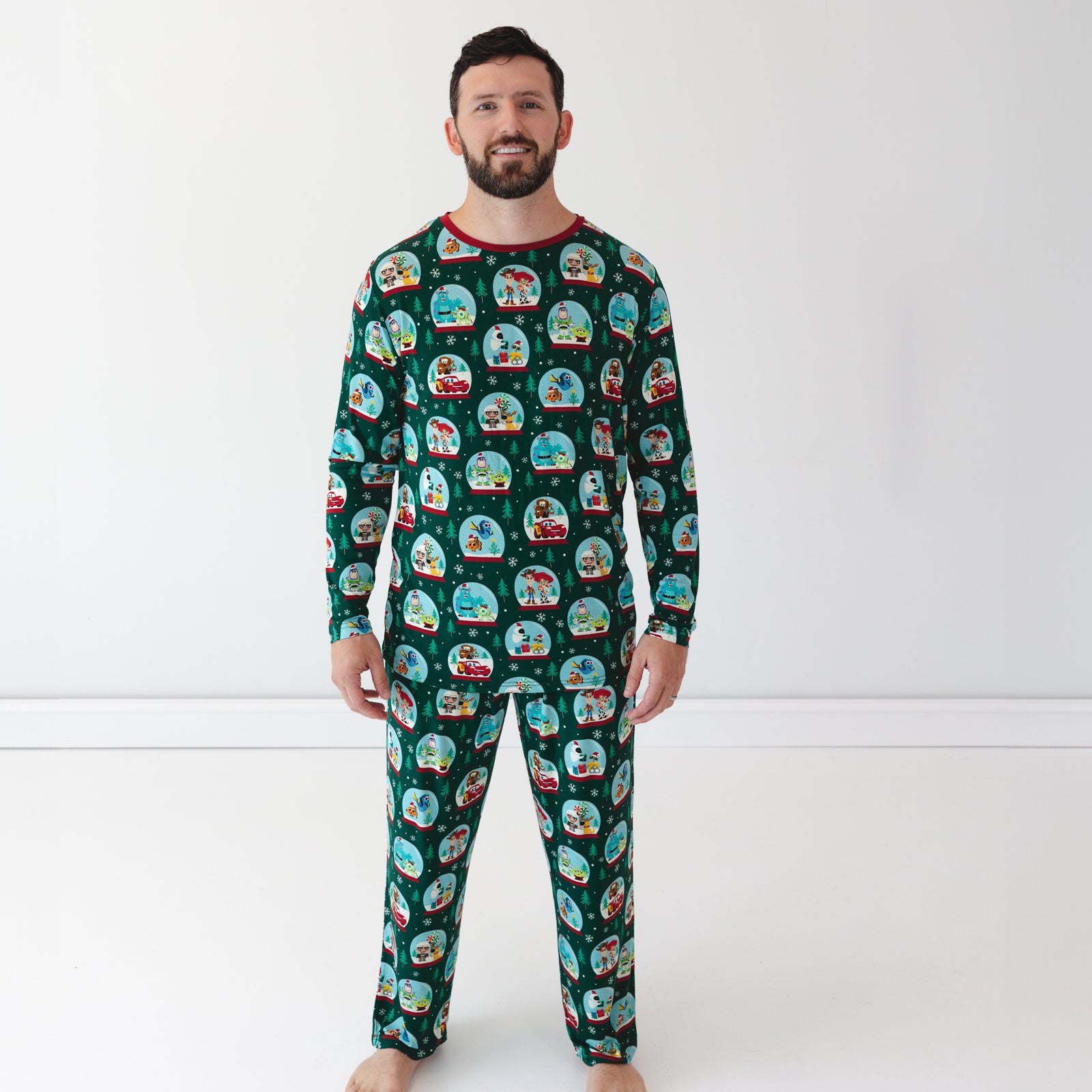 Male model wearing the Disney A Very Pixar Christmas Men's Pajama Pants and Top