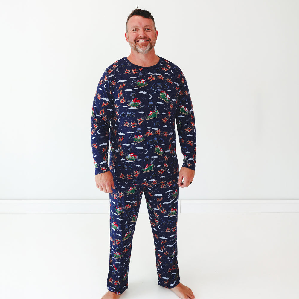 Man wearing Santa's Sleigh Men's Pajama Pants and matching Pajama Top