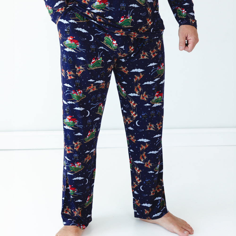 Close up image of a man wearing Santa's Sleigh Men's Pajama Pants