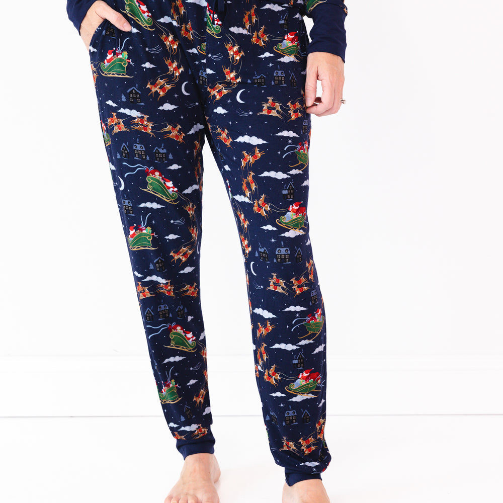 Close up image of a woman wearing Santa's Sleigh Women's Pajama Pants