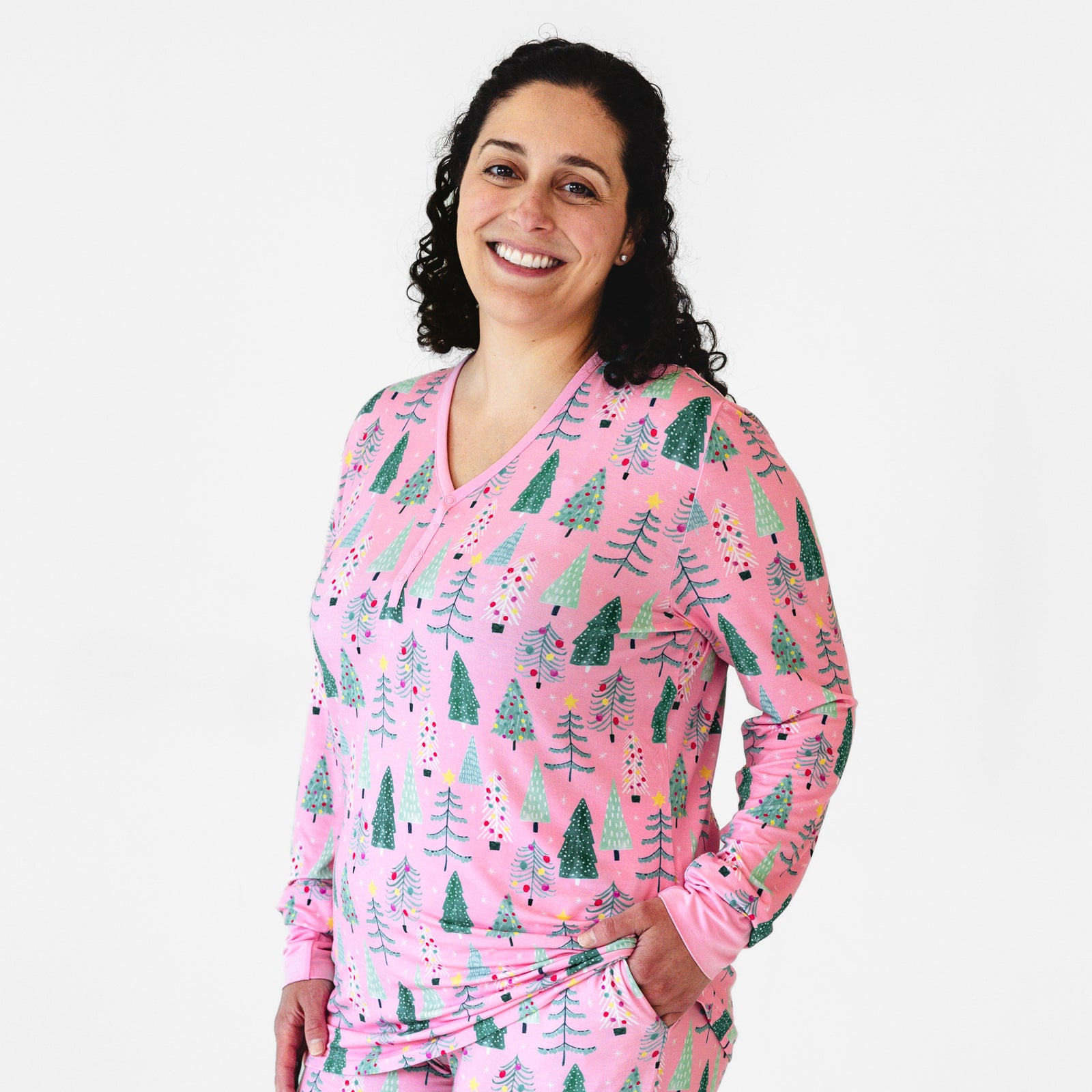 Close up image of a woman wearing a Pink Twinkling Trees Women's Pajama Top