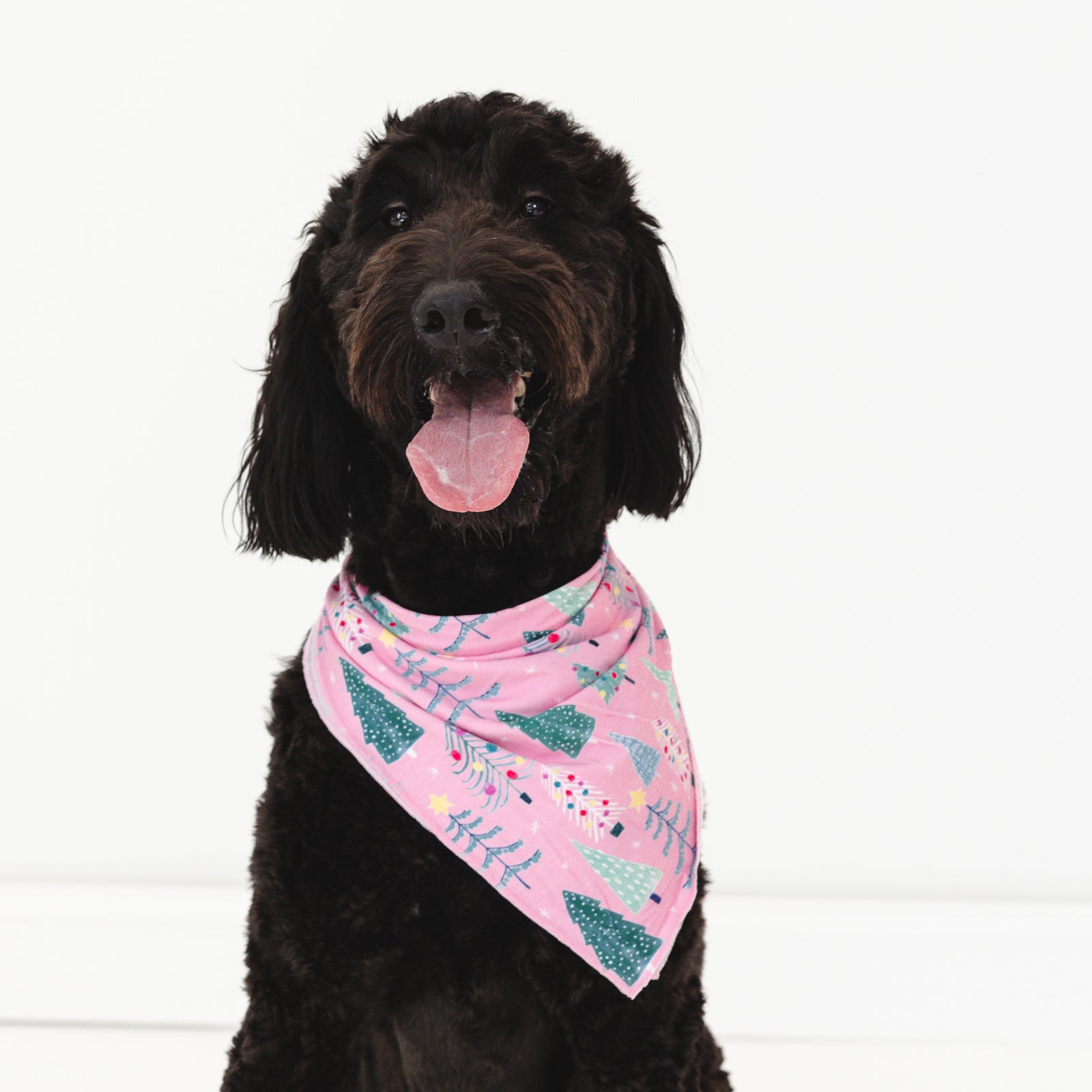 Image of a dog wearing a Pink Twinkling Trees Pet Bandana