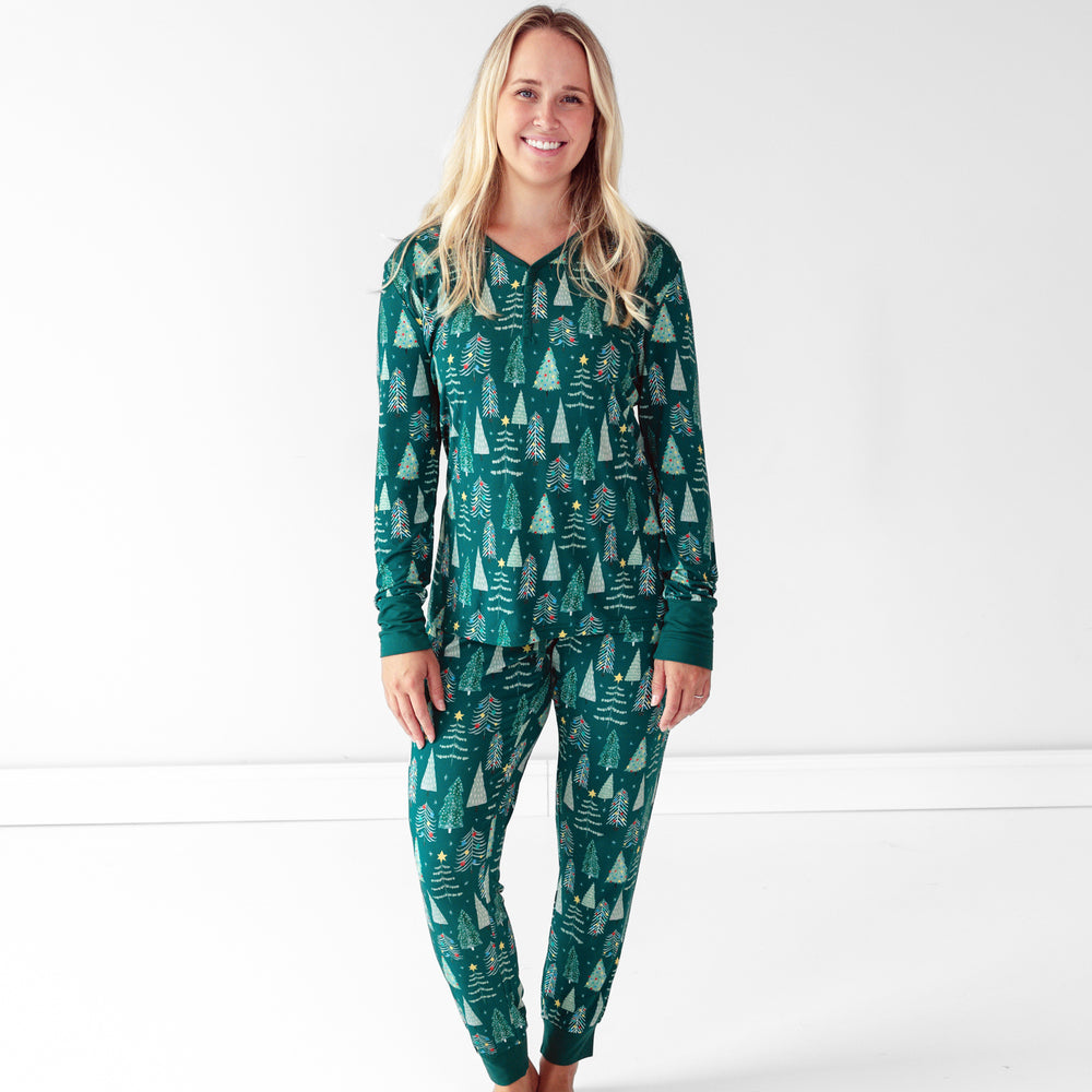 Female model wearing the Green Twinkling Trees Women's Pajama Pants and Green Twinkling Trees Women's Pajama Top