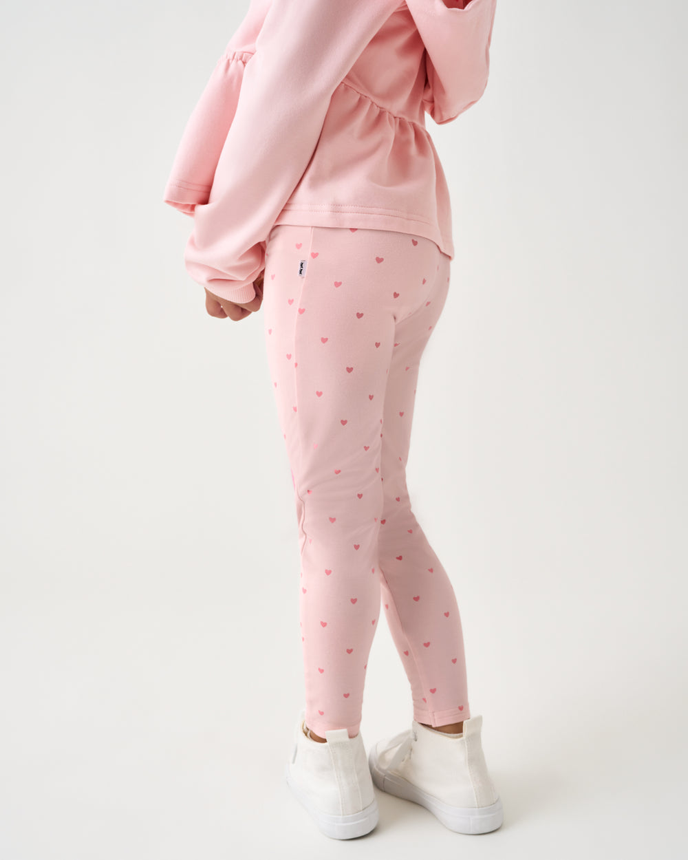 Back view of child wearing the Little Love Heart Patch Legging