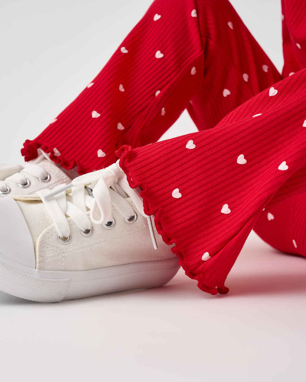 Close up of the ruffle detail on the Little Love Ribbed Flare Pant