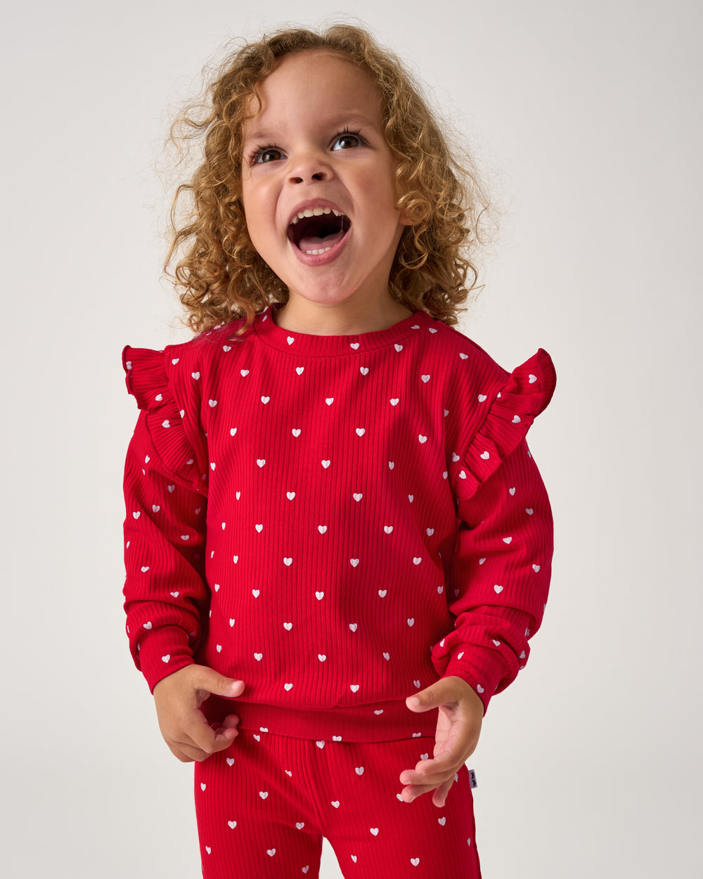 Girl wearing the Little Love Ribbed Flutter Crewneck