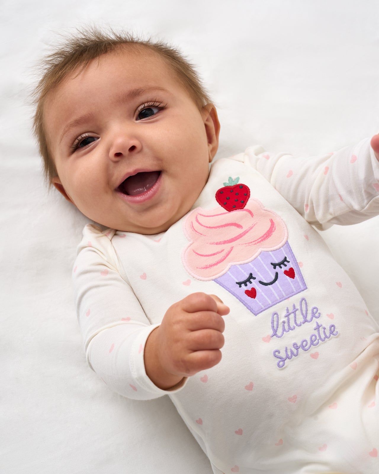 Close up of baby wearing the Little Sweetie Puff Sleeve Bodysuit
