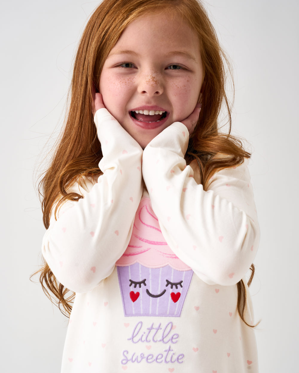 Posing girl wearing the Little Sweetie Puff Sleeve Tee