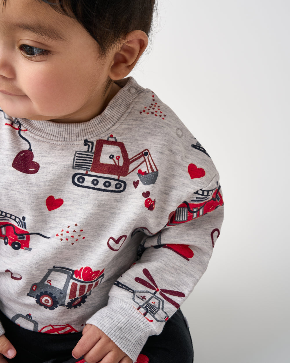 Close of the shoulder buttons on the Loads of Love Easy Crewneck Sweatshirt