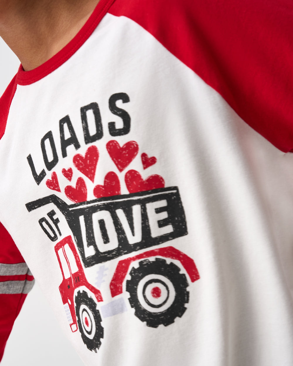 Close up of the graphic on the Loads of Love Raglan Tee