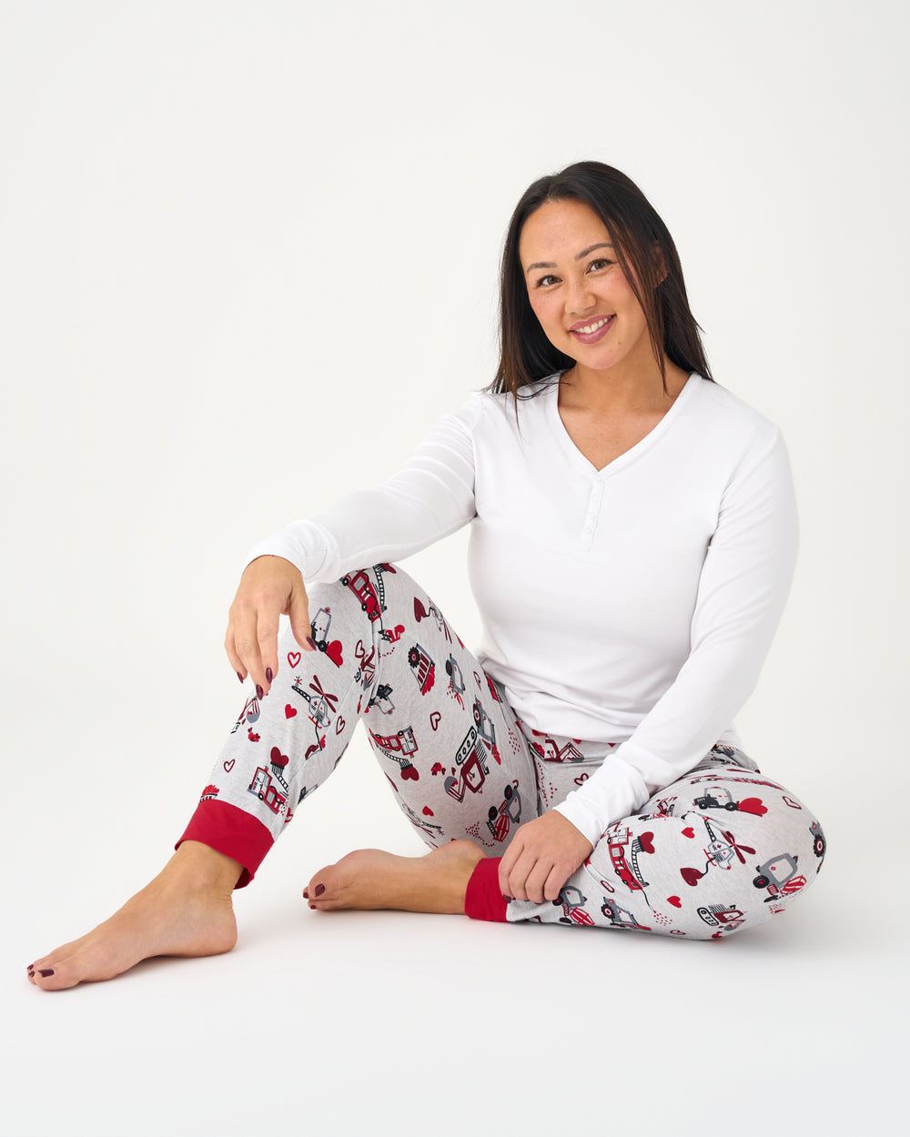 Sitting woman wearing the Loads of Love Women's Pajama Pants