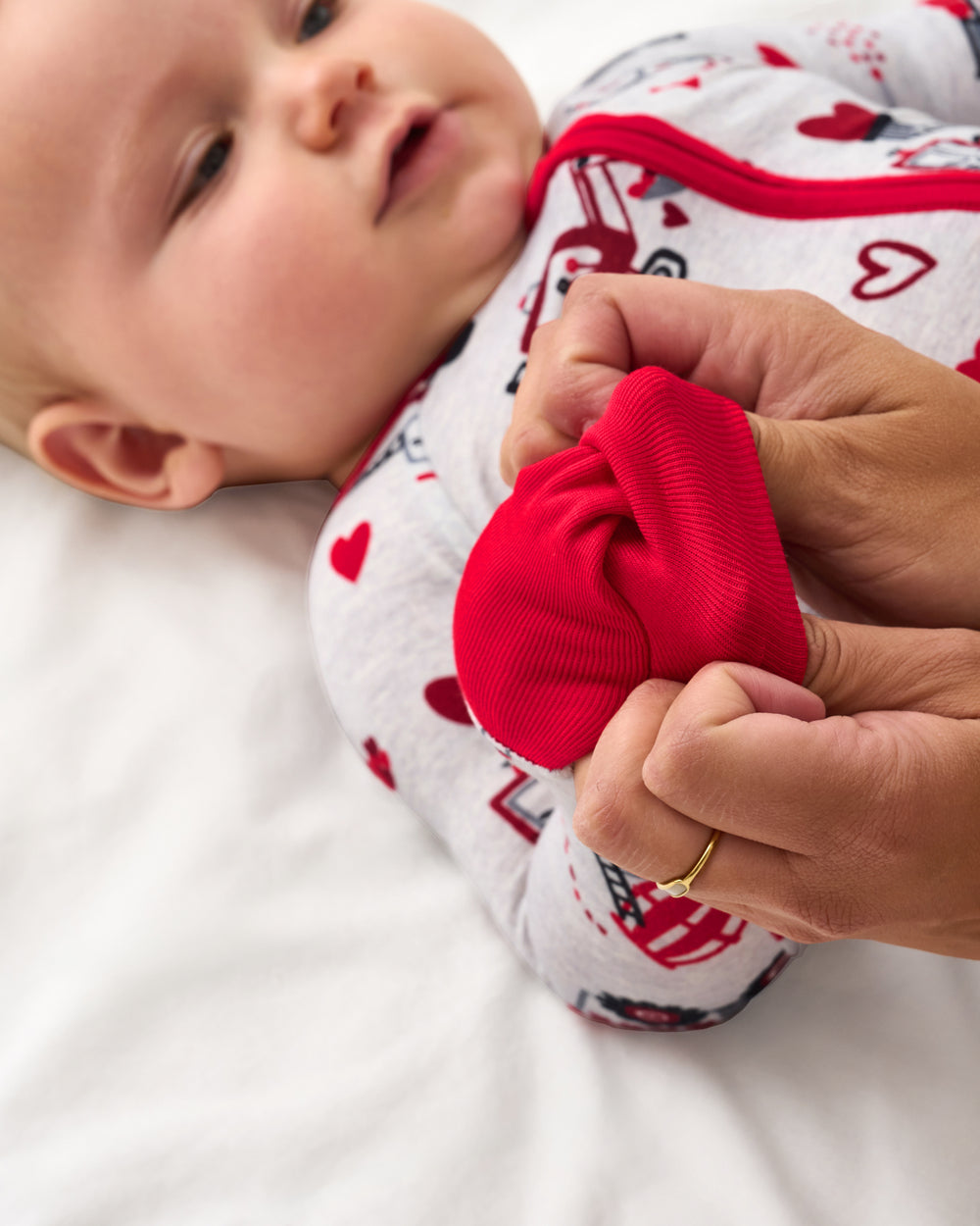 Adult demonstrating hand covers on the Loads of Love Zippy