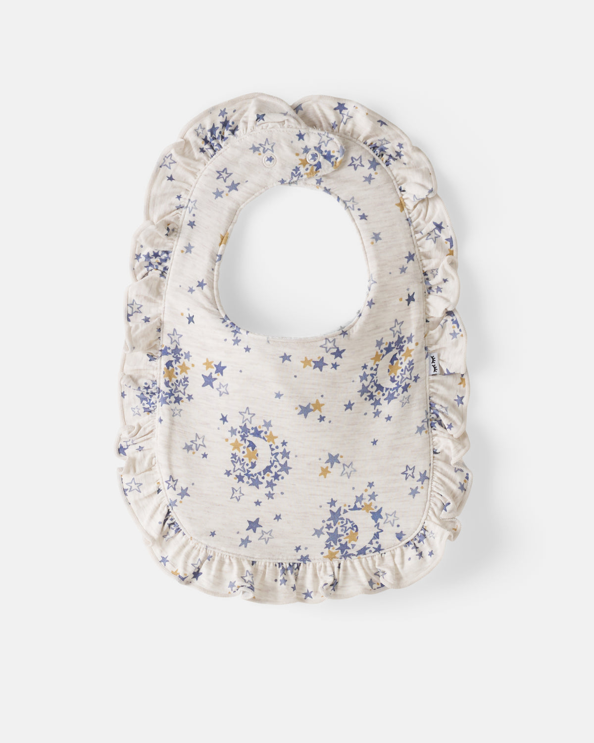 Flat lay of the Lullaby Sky Ruffle Bib