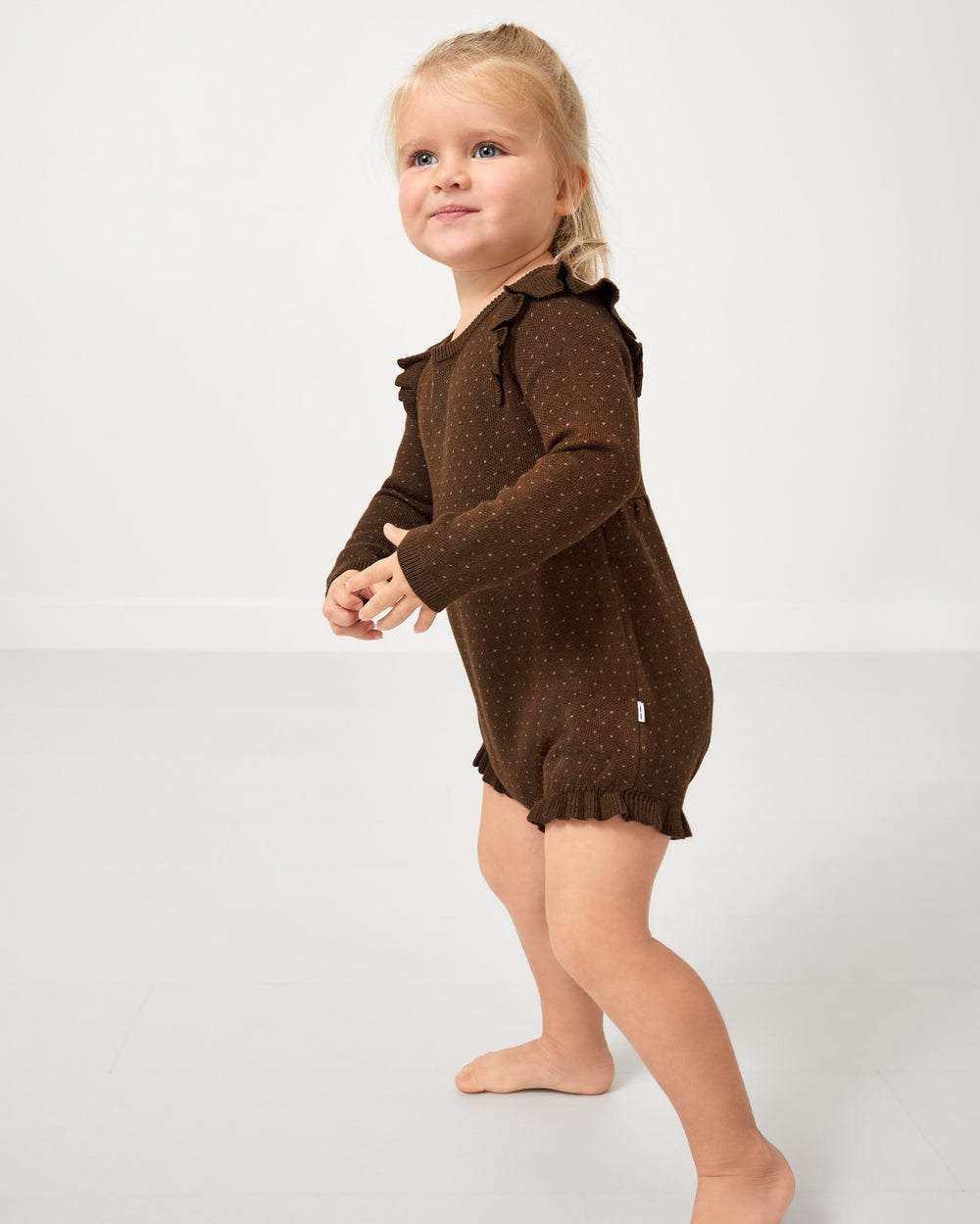 Child wearing the Mocha Sweater Bubble Romper
