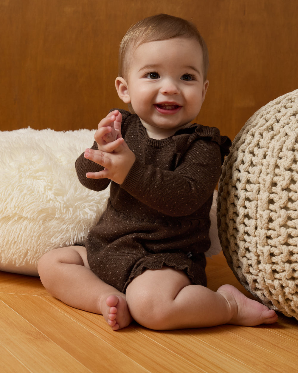 Sitting baby wearing the Mocha Sweater Bubble Romper