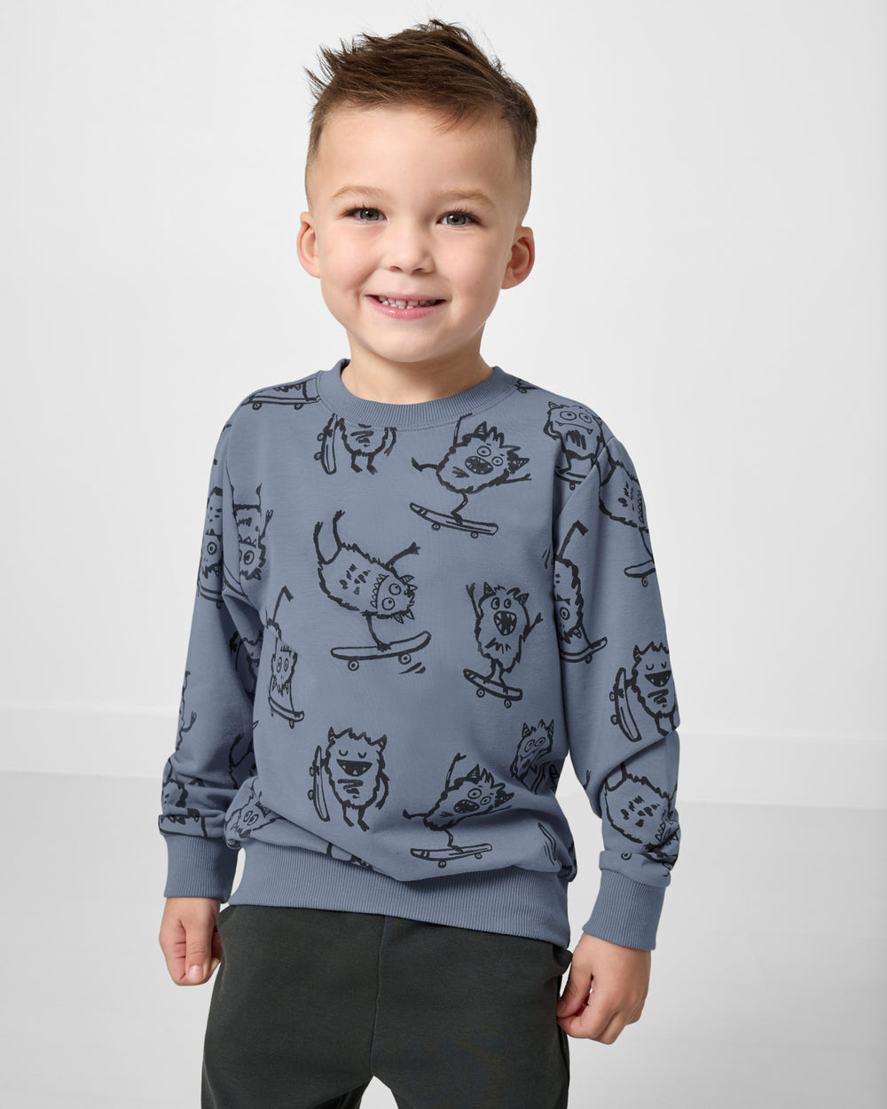 Boy wearing the Monster Moves Crewneck Sweatshirt