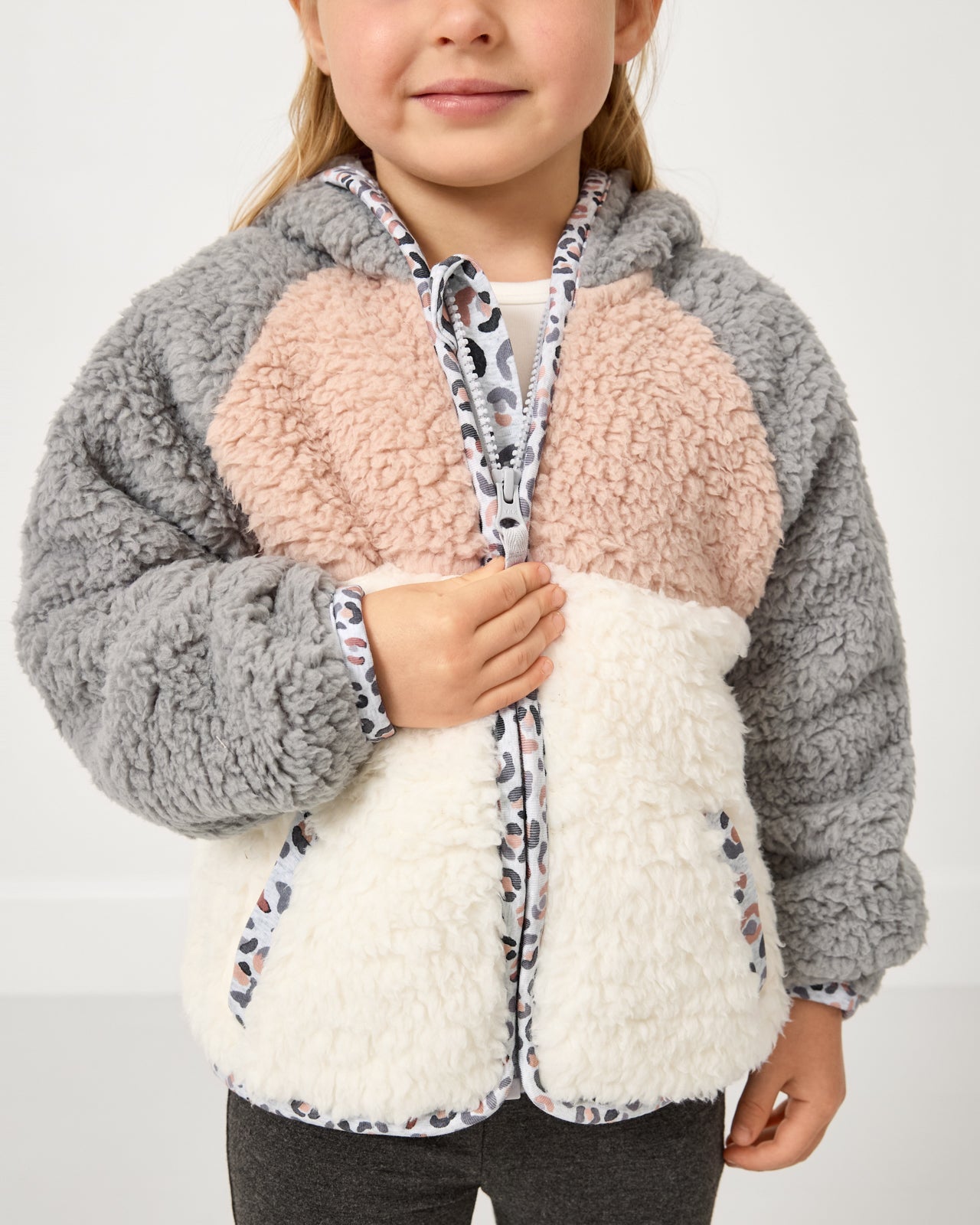 Close up of girl wearing the Morning Fog Sherpa Jacket