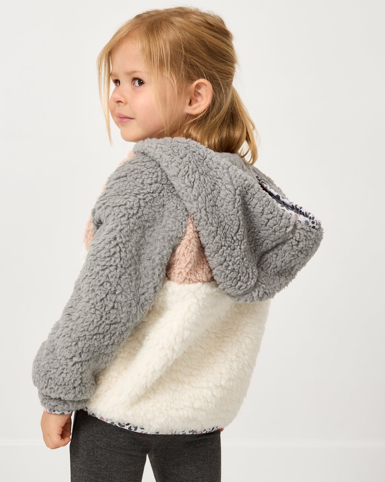 Back view of girl wearing the Morning Fog Sherpa Jacket