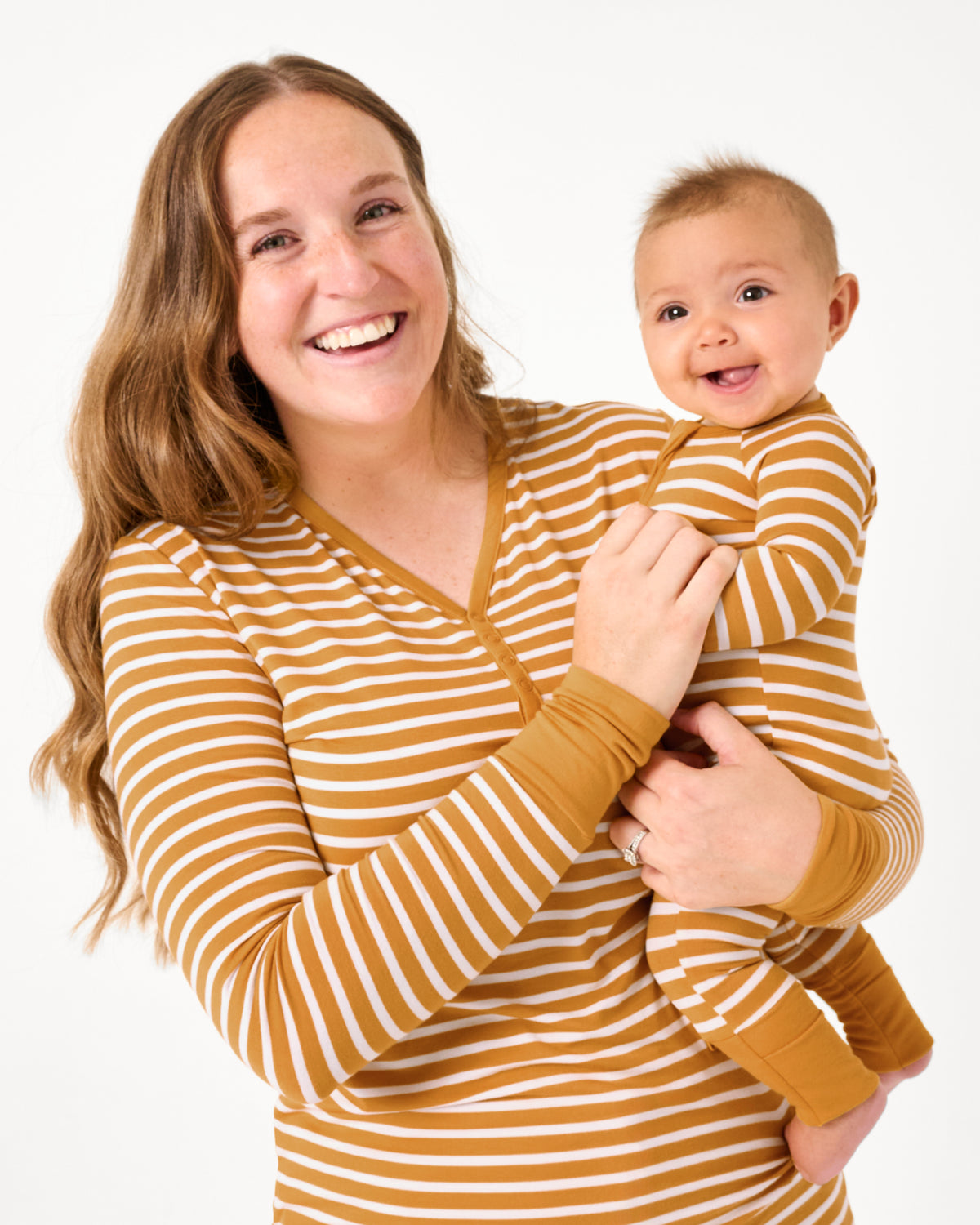 Mother and newborn wearing Marigold Stripe bamboo pajamas