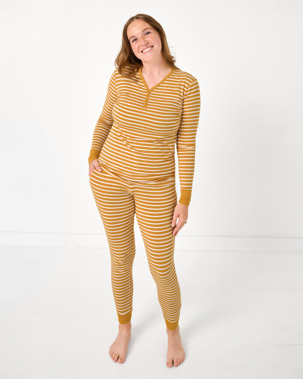 Woman wearing the Marigold Stripe Women's Long Sleeve Pajama Top and Pants