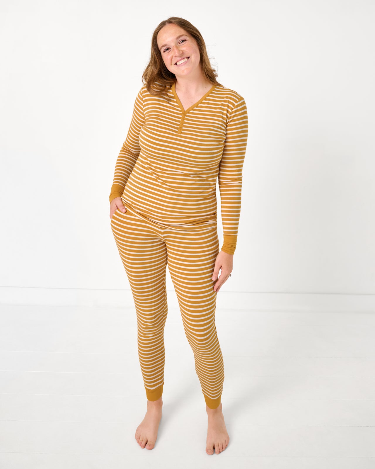 Woman wearing the Marigold Stripe Women's Long Sleeve Pajama Top and Pants