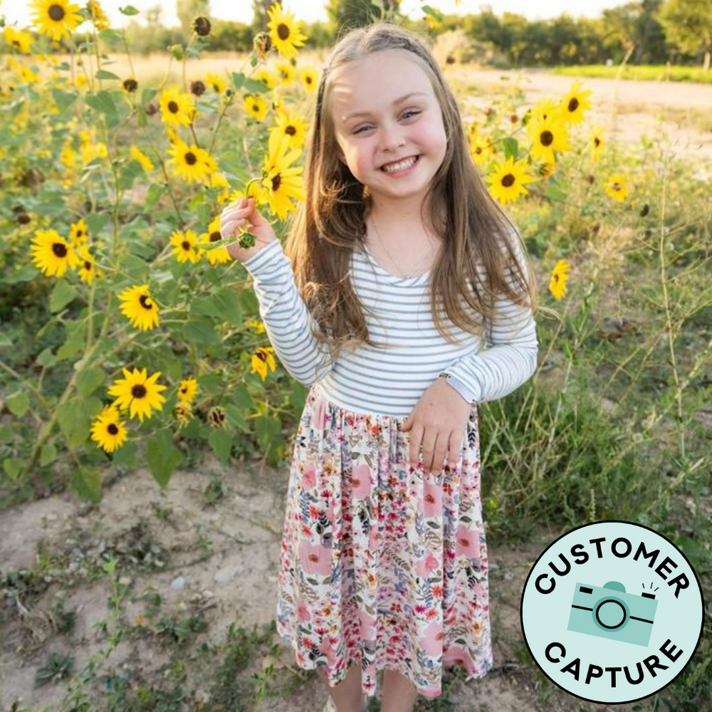 Click to see full screen - Customer Capture image of a child wearing a Mauve Meadow Stripes Skater Dress