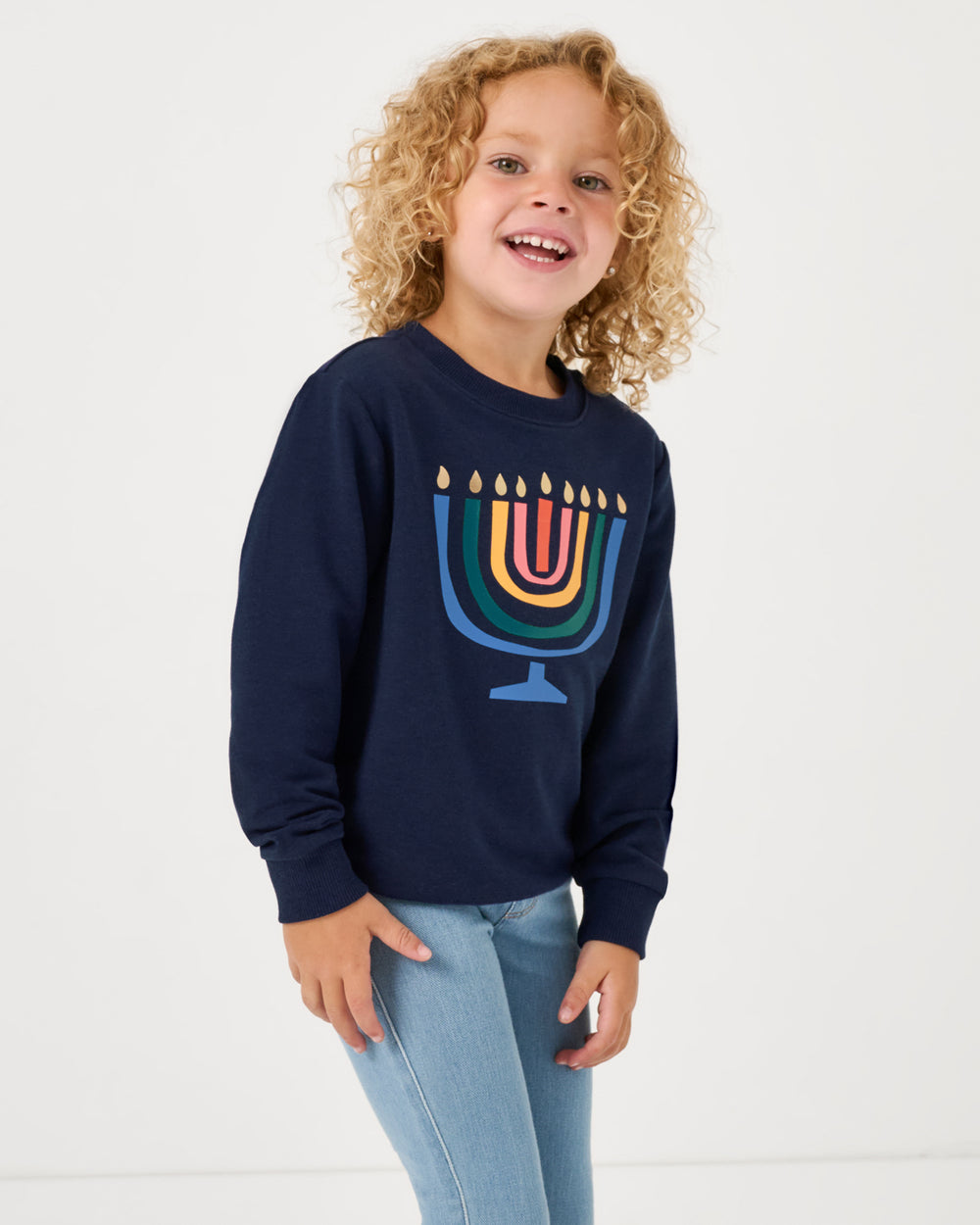 Girl wearing the Menorah Crewneck Sweatshirt with denim pants