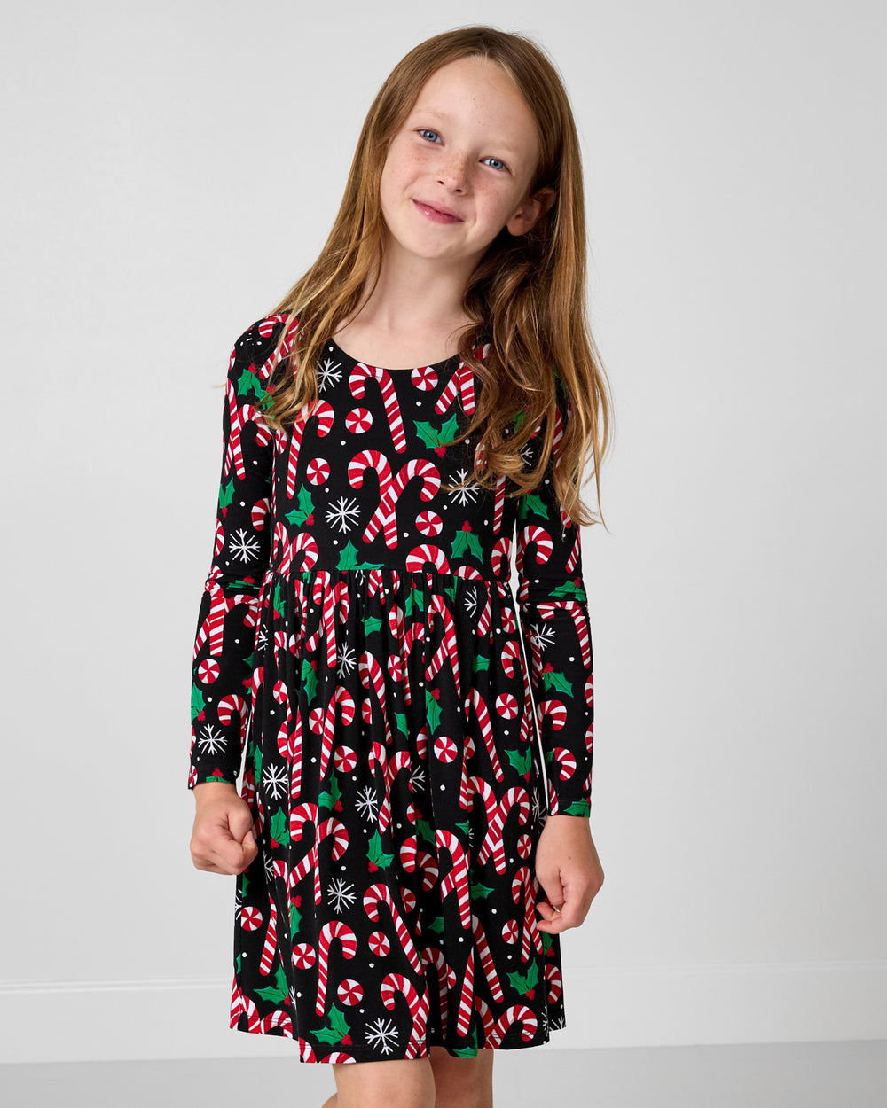 Girl wearing the Merry Mints Bow Back Skater Dress