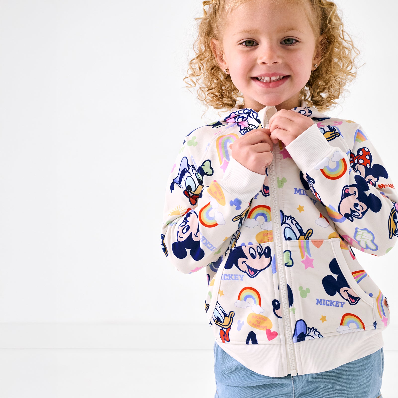 Close up of girl wearing the Disney Mickey's Clubhouse Themed Minnie Zip Hoodie