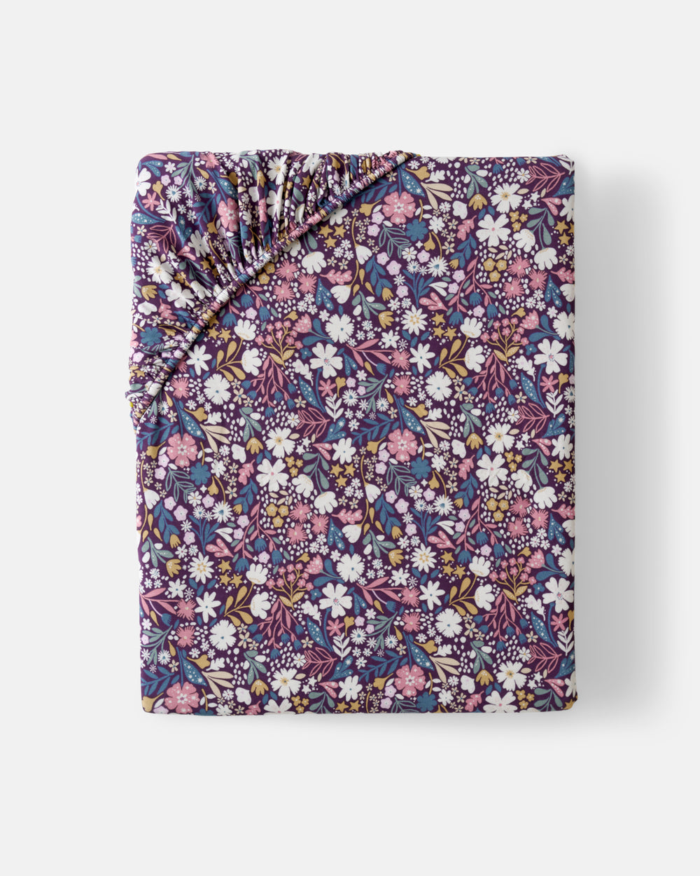 Flat lay of the Standard Midnight Petals Fitted Crib Sheet