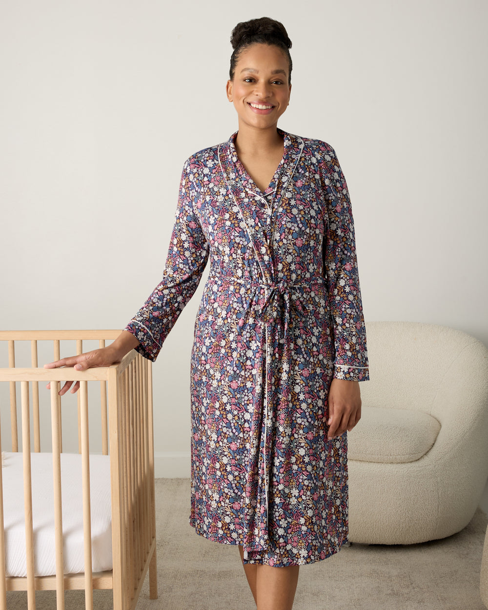 Alternate woman wearing the Midnight Petals Women's Robe in a nursery