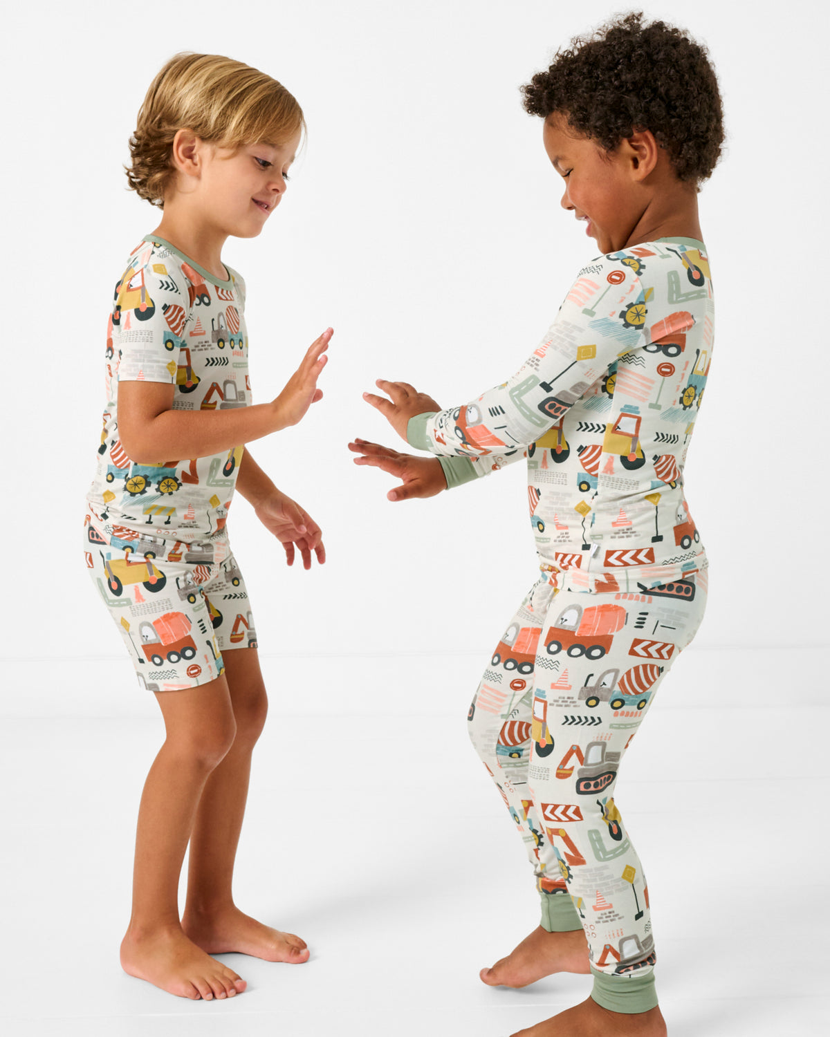 Two boys wearing matching matching Mini Builders Two-Piece PJ Sets
