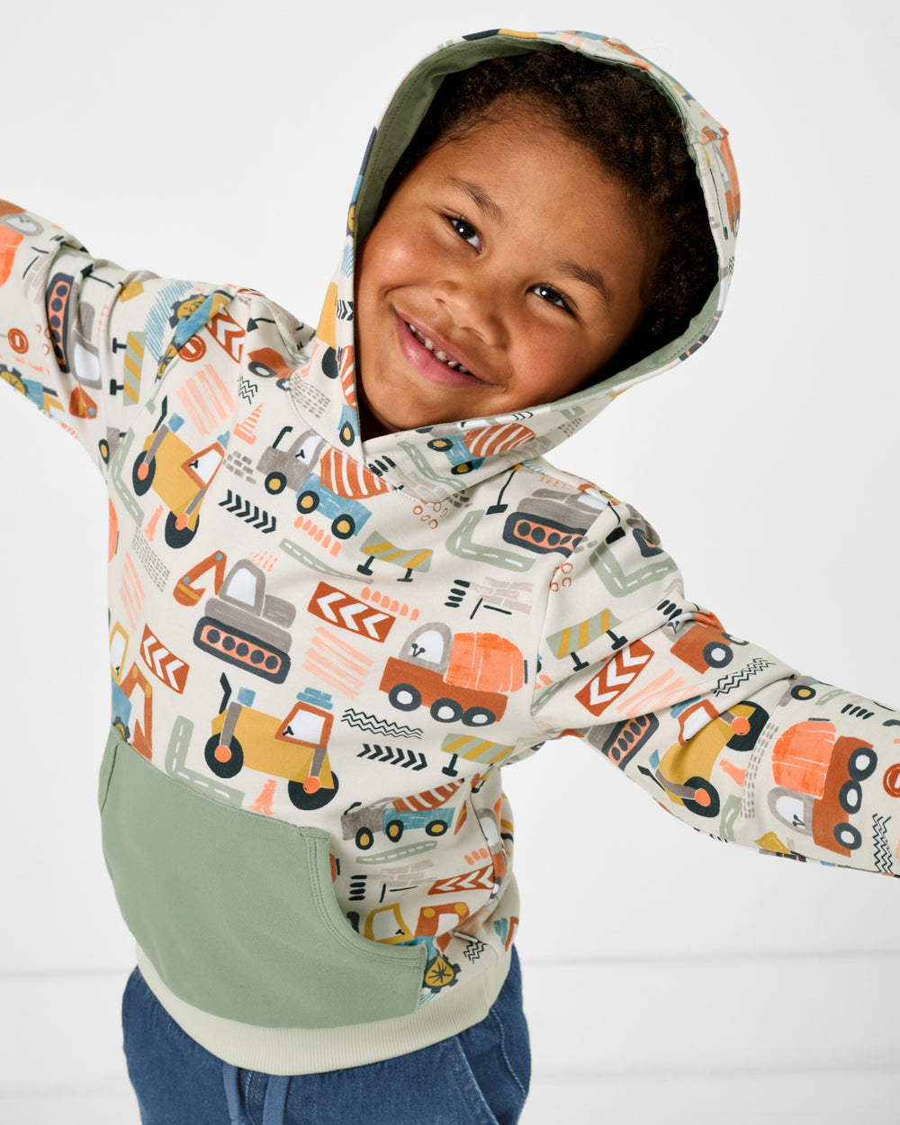 Posing boy wearing the Mini Builders Pullover Hoodie