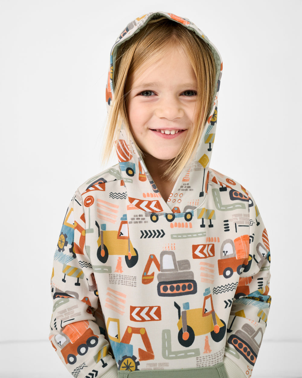 Girl wearing the Mini Builders Pullover Hoodie with the hood on