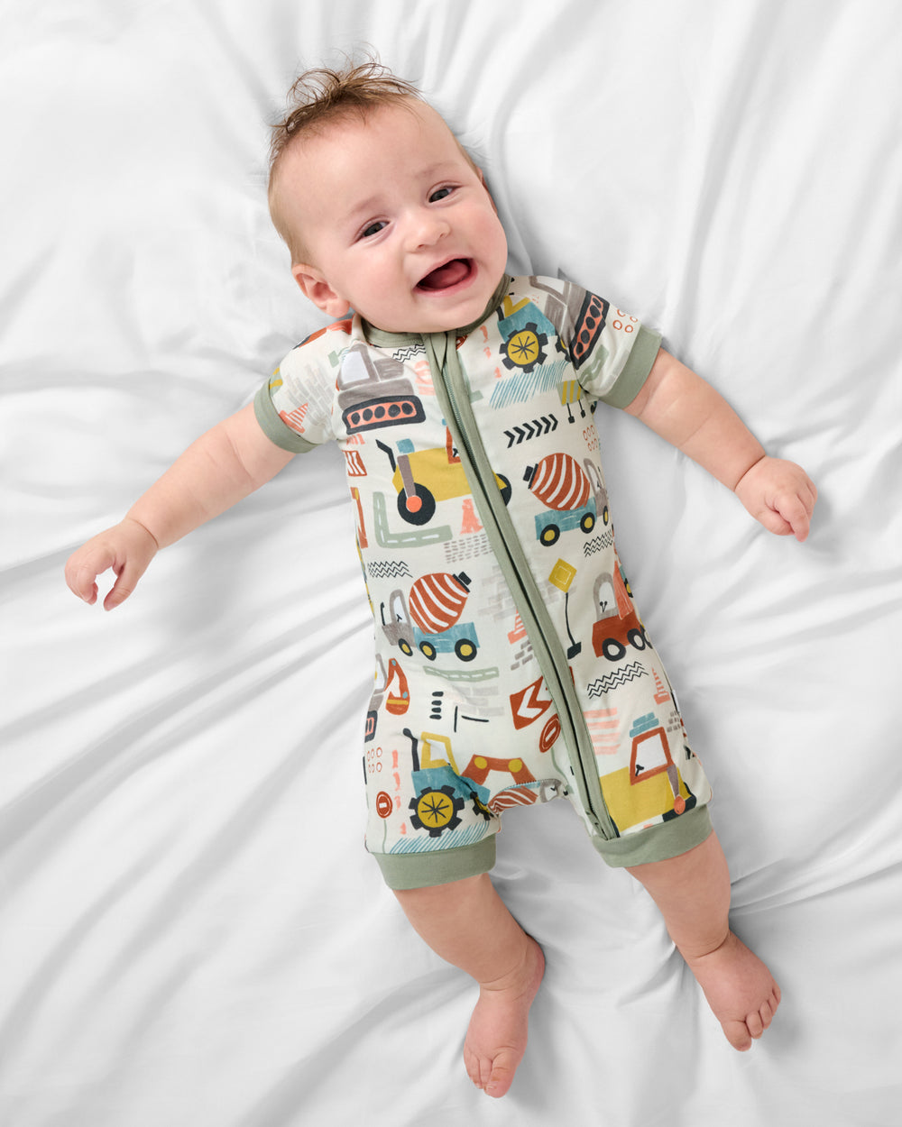 Aerial view of baby wearing the Mini Builders Shorty Zippy