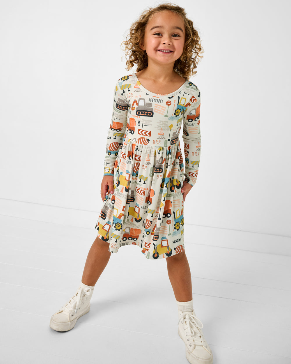 Girl wearing the Mini Builders Skater Dress