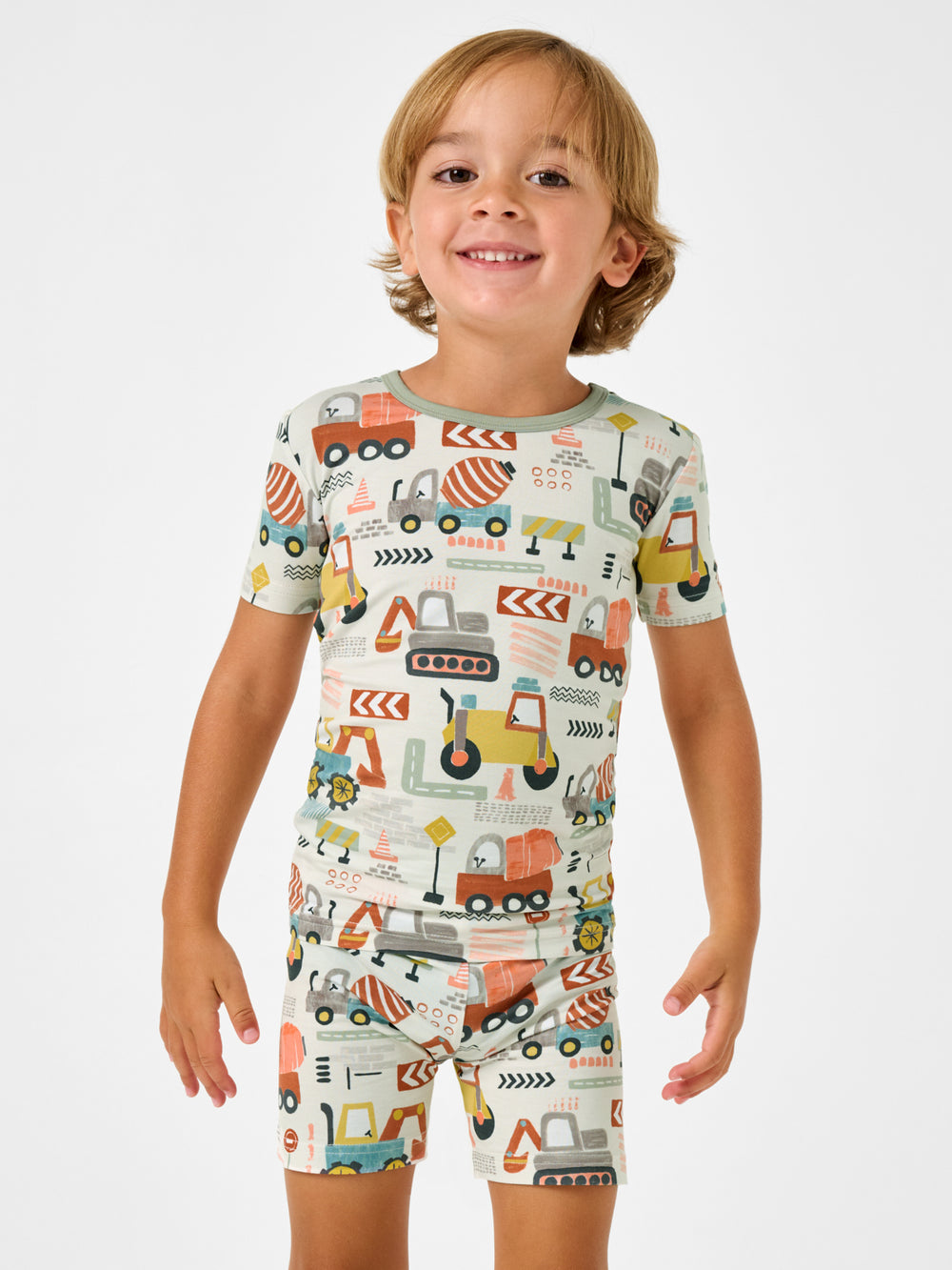 Boy wearing the Mini Builders Two-Piece Short Sleeve & Shorts Pajama Set