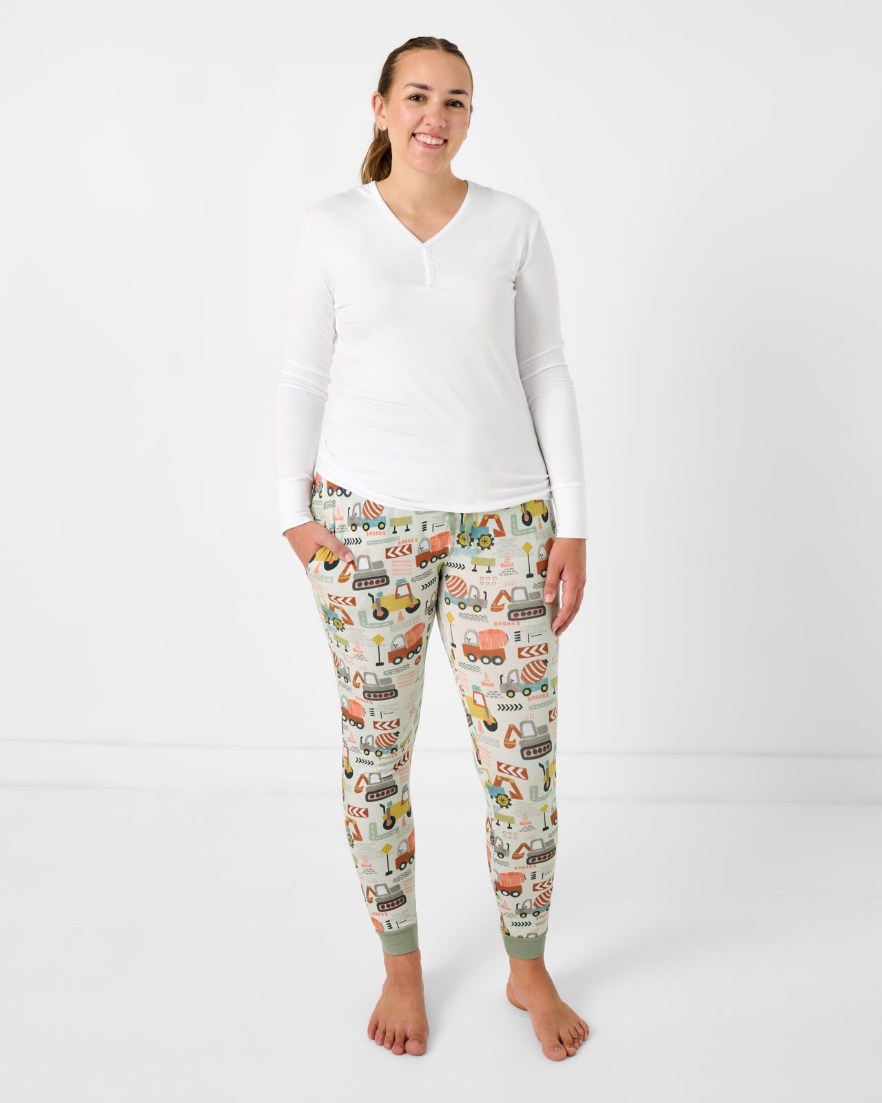 Woman wearing the Mini Builders Women's Pajama Pants with a white pajama top
