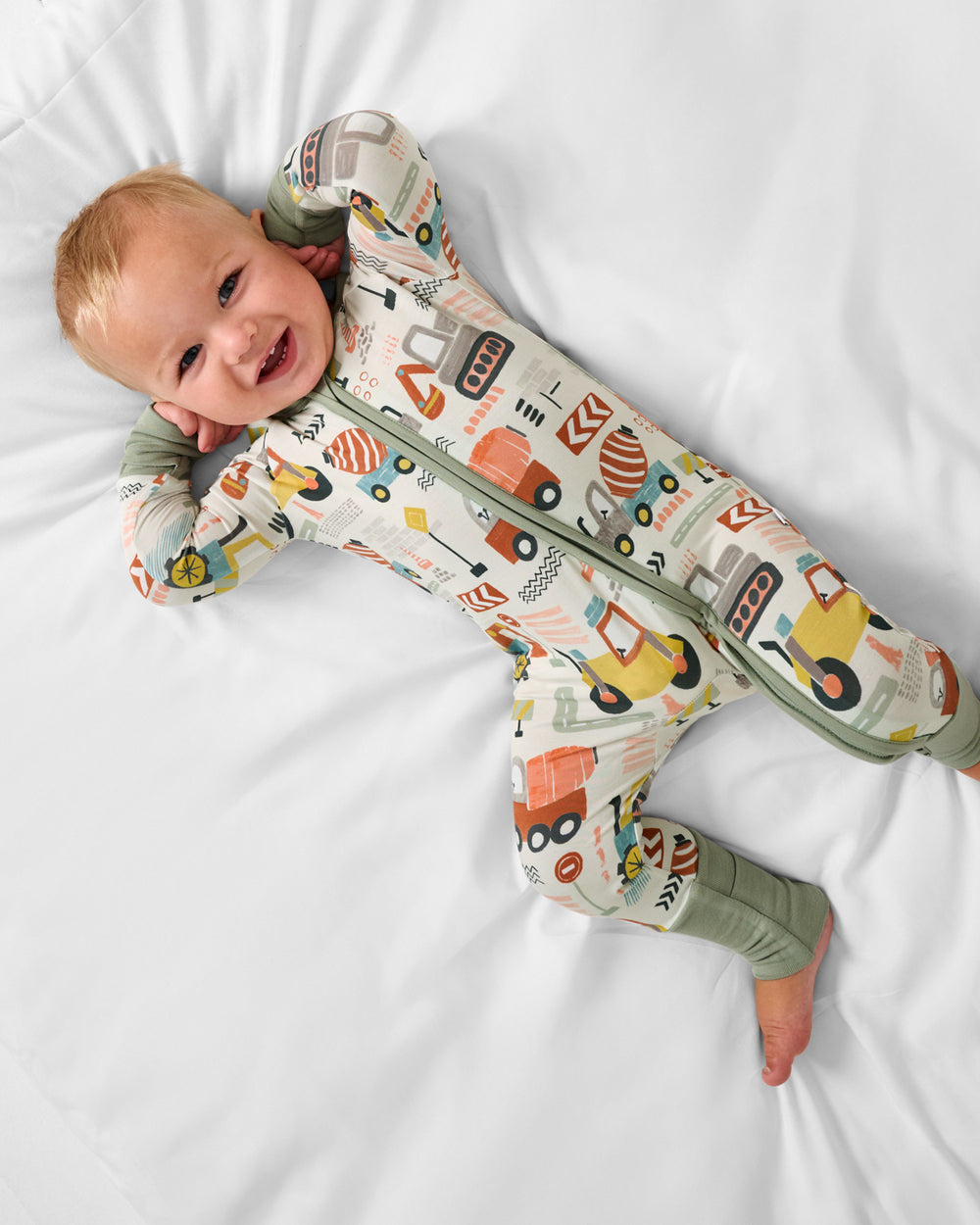 Aerial view of baby wearing the Mini Builders Zippy