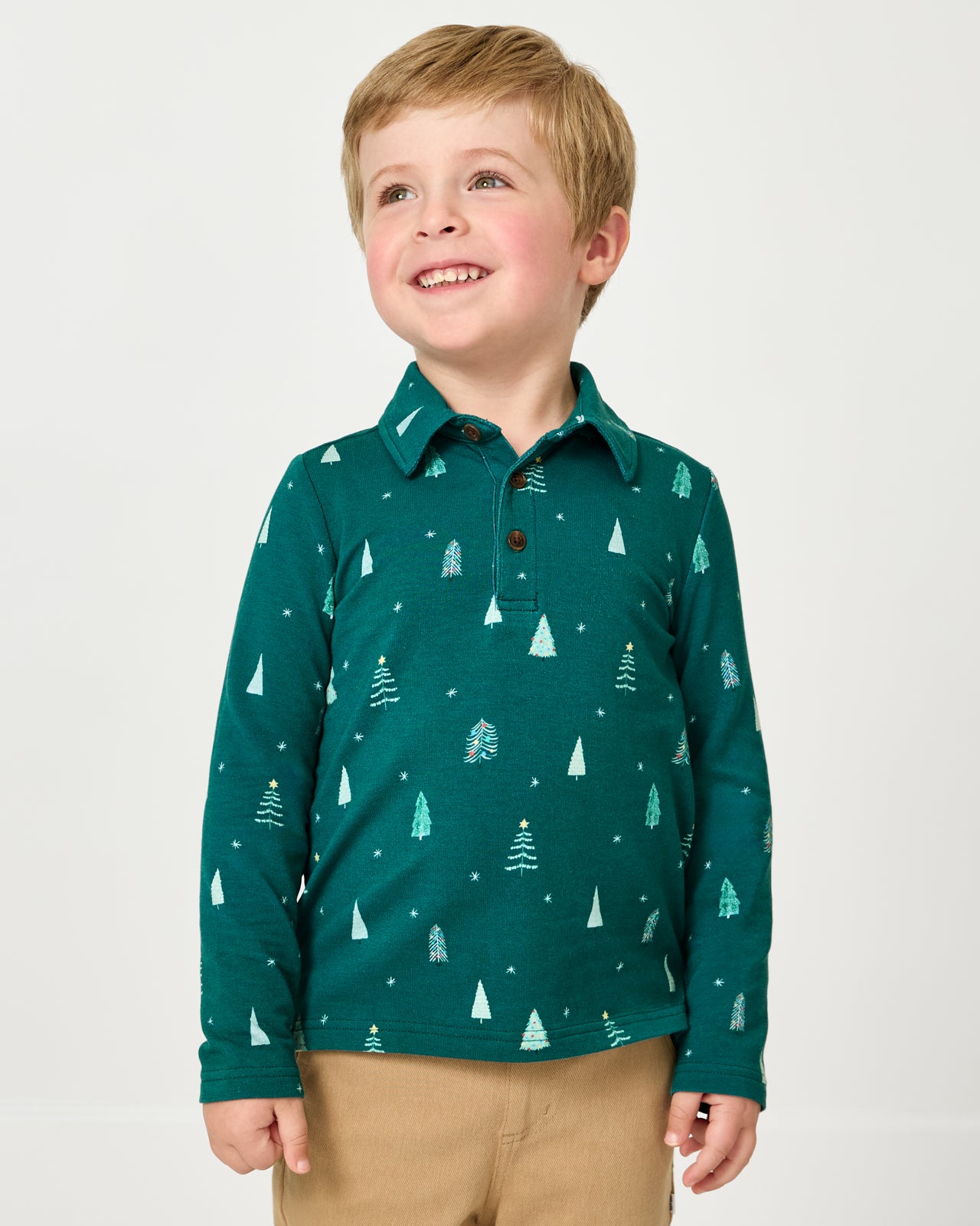 Boy wearing the Twinkling Trees Polo Shirt